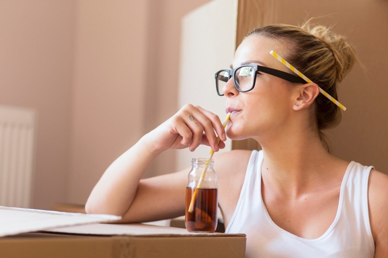 woman drinking beverage