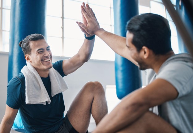 two men high fiving