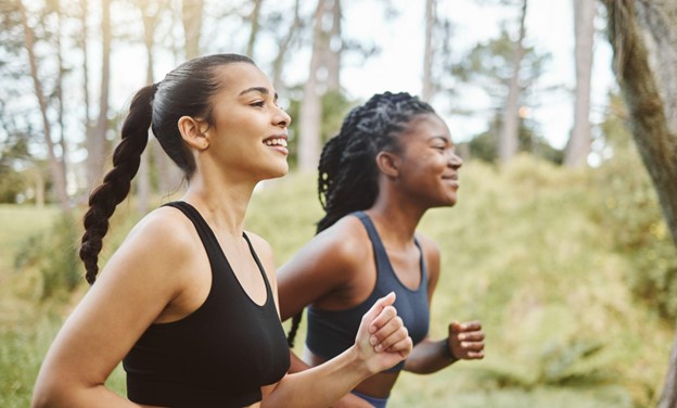 two women running