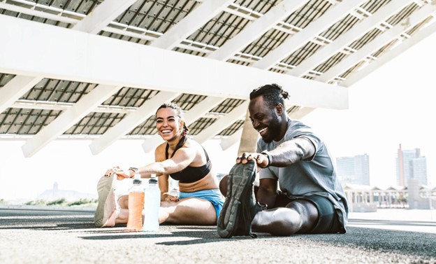 man and woman stretching