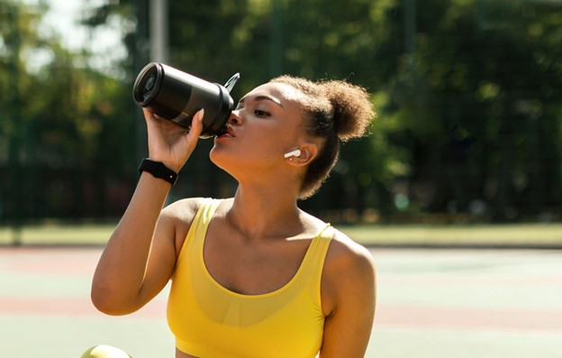 woman drinking protein shake