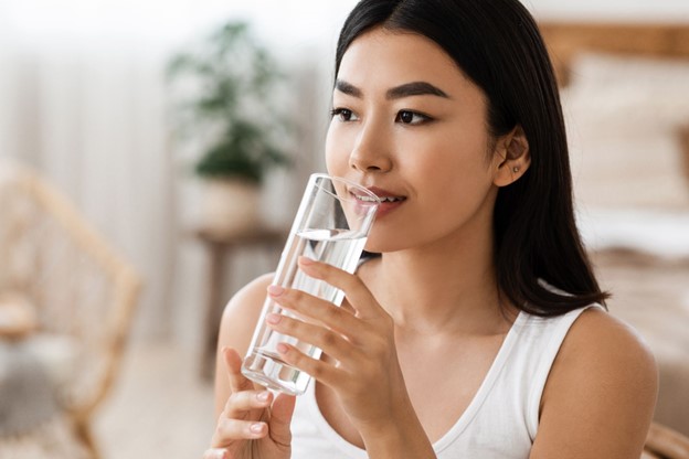 woman with water for hydration