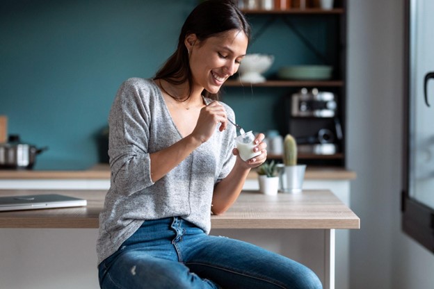 woman eating yogurt