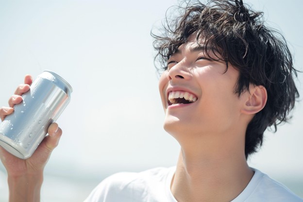 man drinking beverage