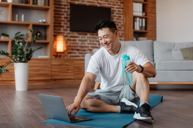 man on yoga mat doing workout