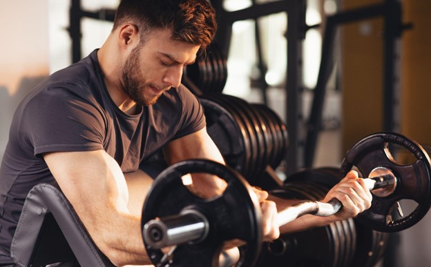 man lifting weights