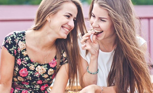 two girls snacking