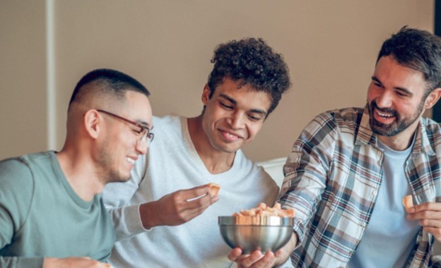 group of men snacking