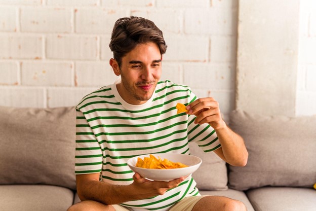 man eating chips