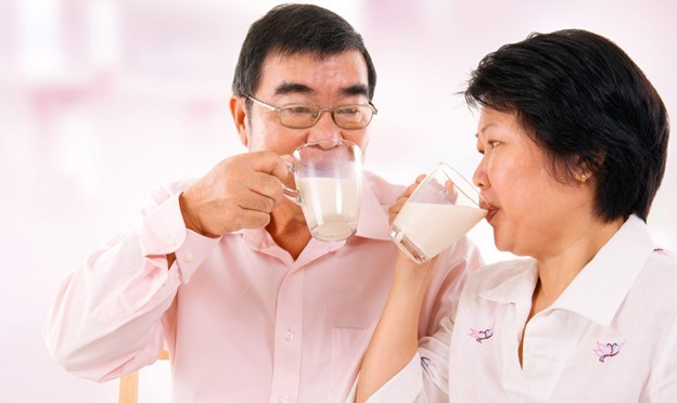 senior couple drinking milk