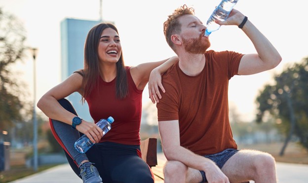 man and woman sitting together after workout