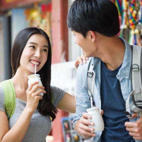 man and woman with beverage