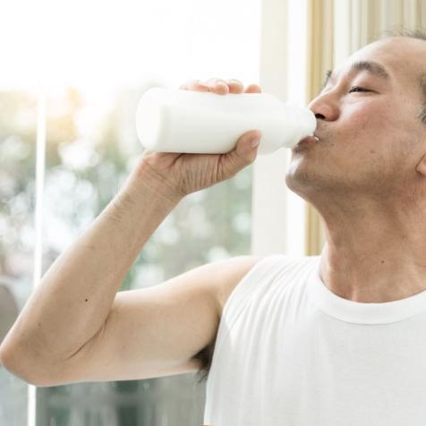 man drinking milk