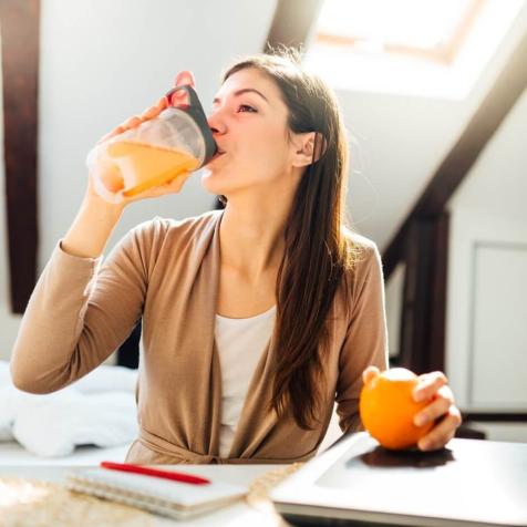 woman drinking premix drink