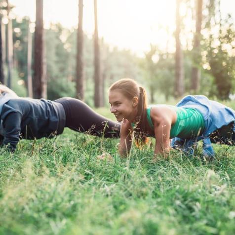 two girls doing push ups
