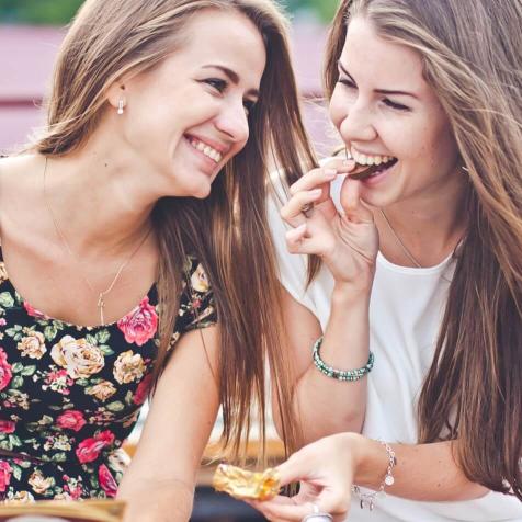 two girls snacking