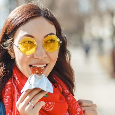 woman eating bar