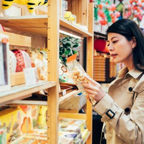 woman looking at food in market