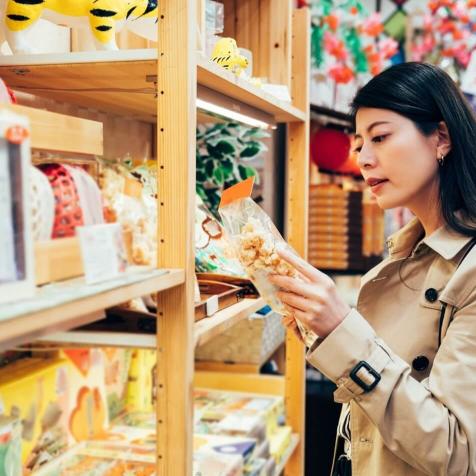 woman looking at food in market