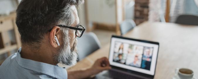 man watching webinar
