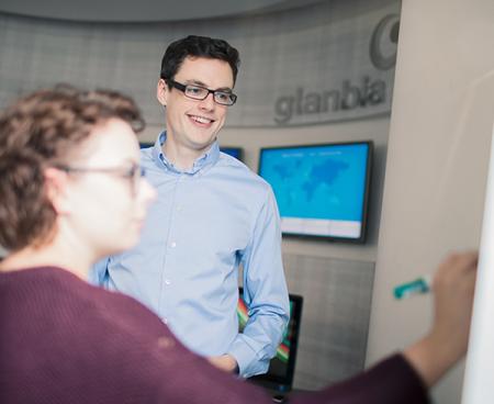 Two Glanbia Employees Looking at Unique insights