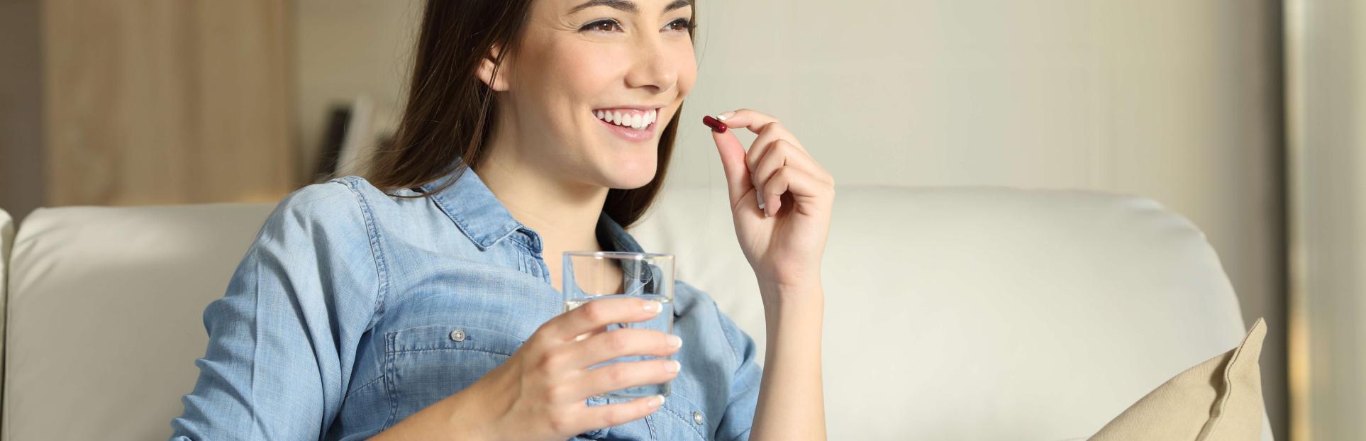 woman taking supplement