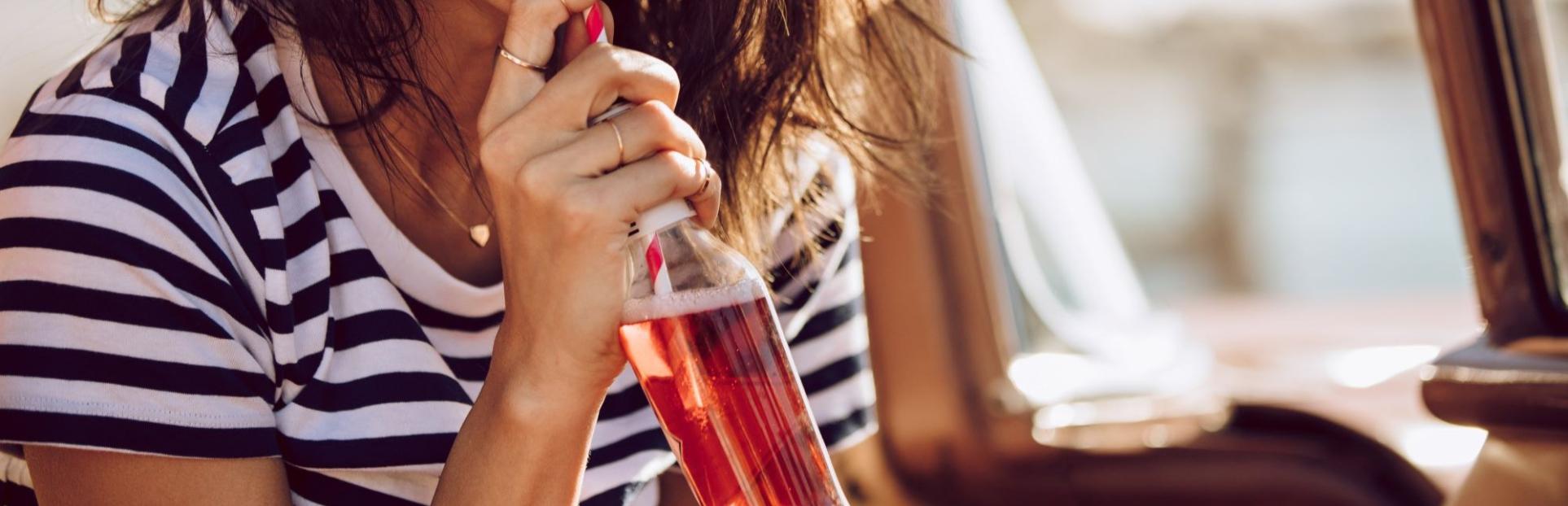 woman drinking beverage