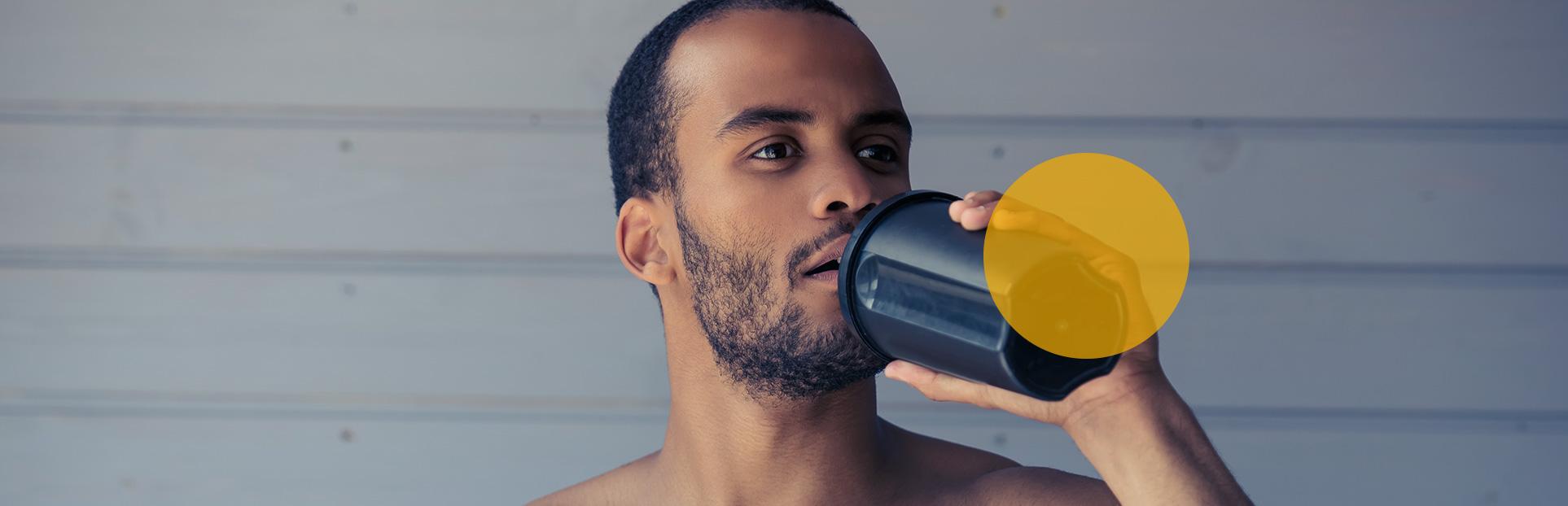 man drinking protein shake