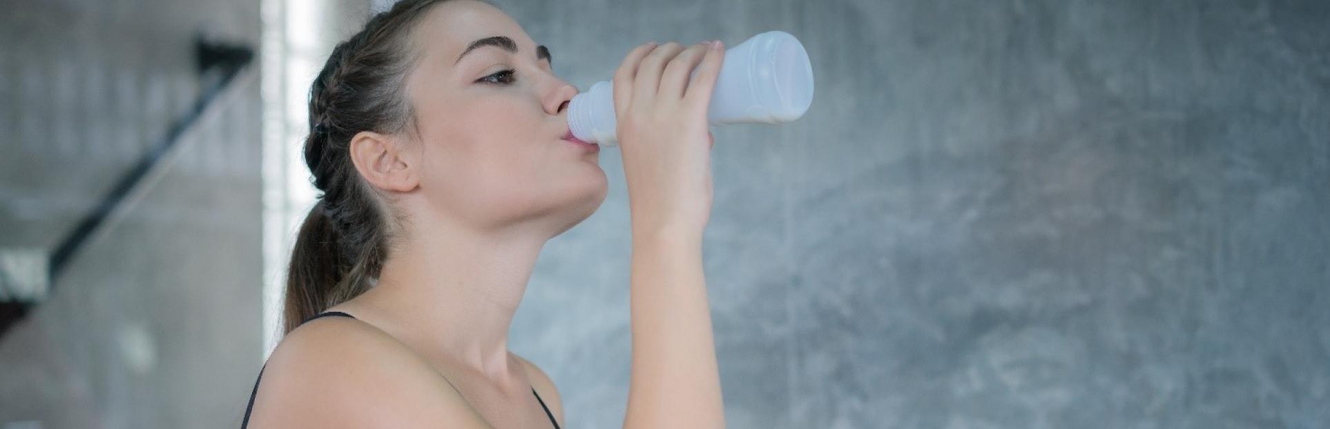 woman drinking beverage