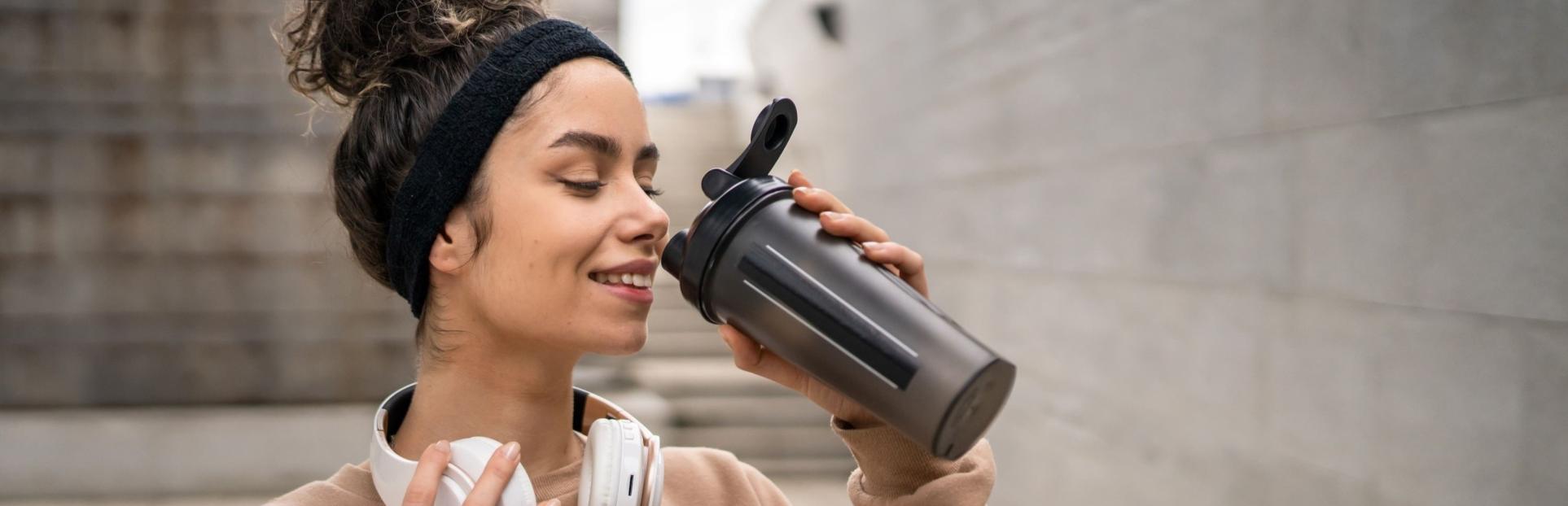 woman drinking protein shake
