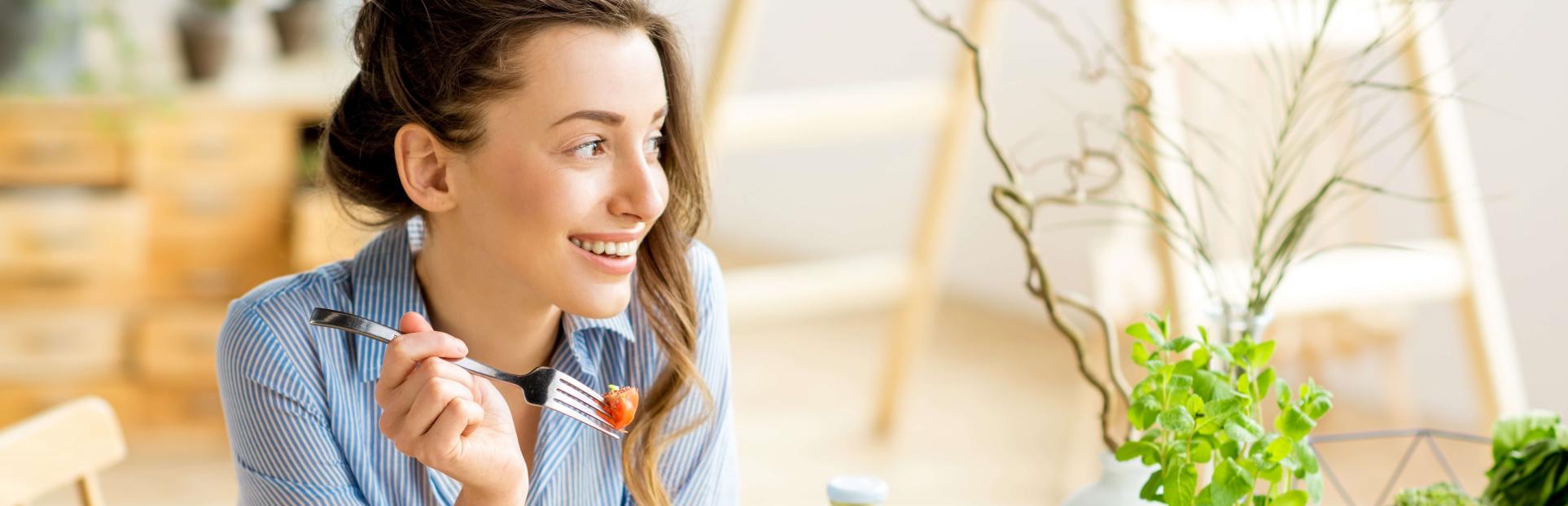 woman eating salad