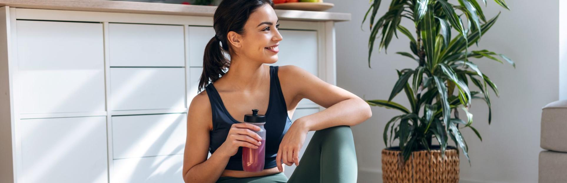 woman drinking beverage and eating bowl