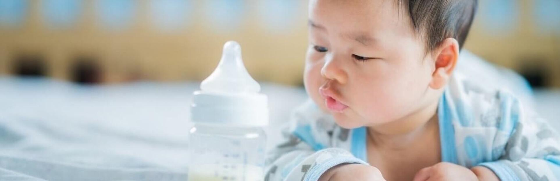 baby with bottle of milk