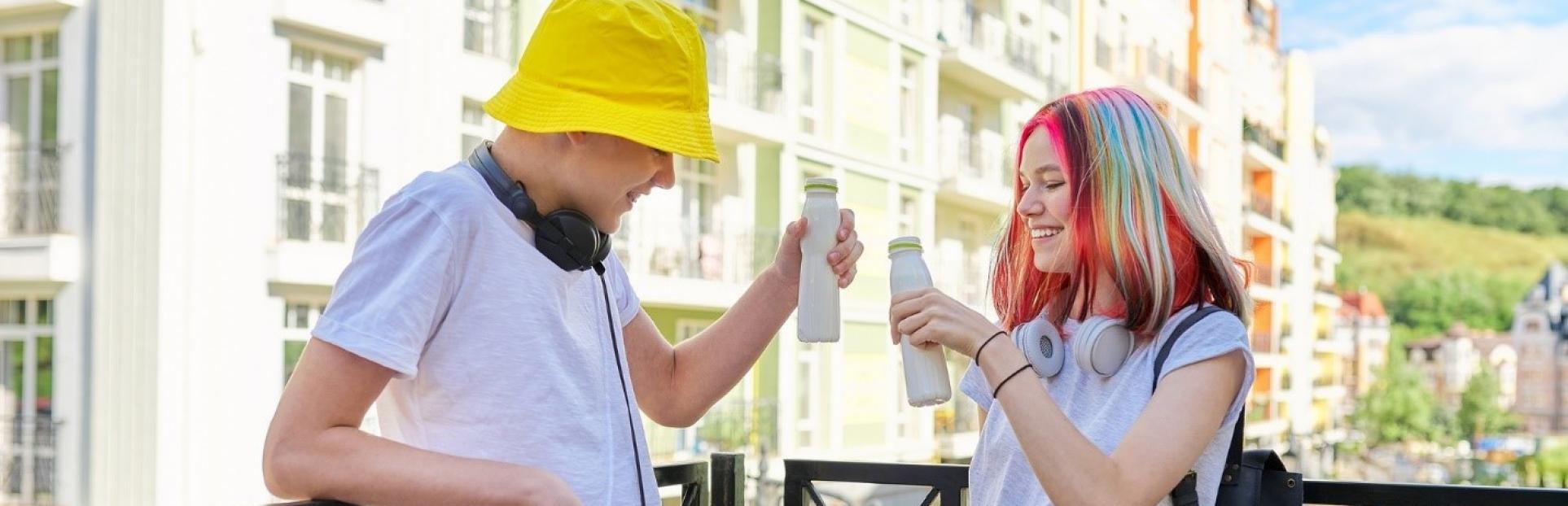 couple driking kefir on balcony