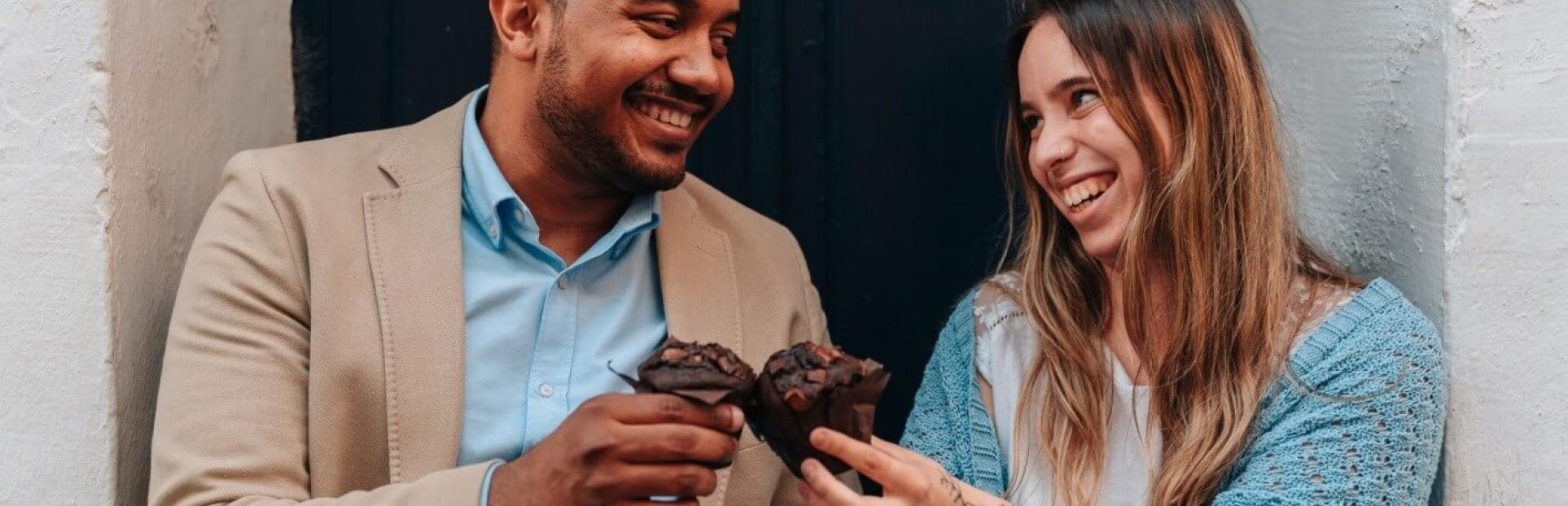 couple eating muffins