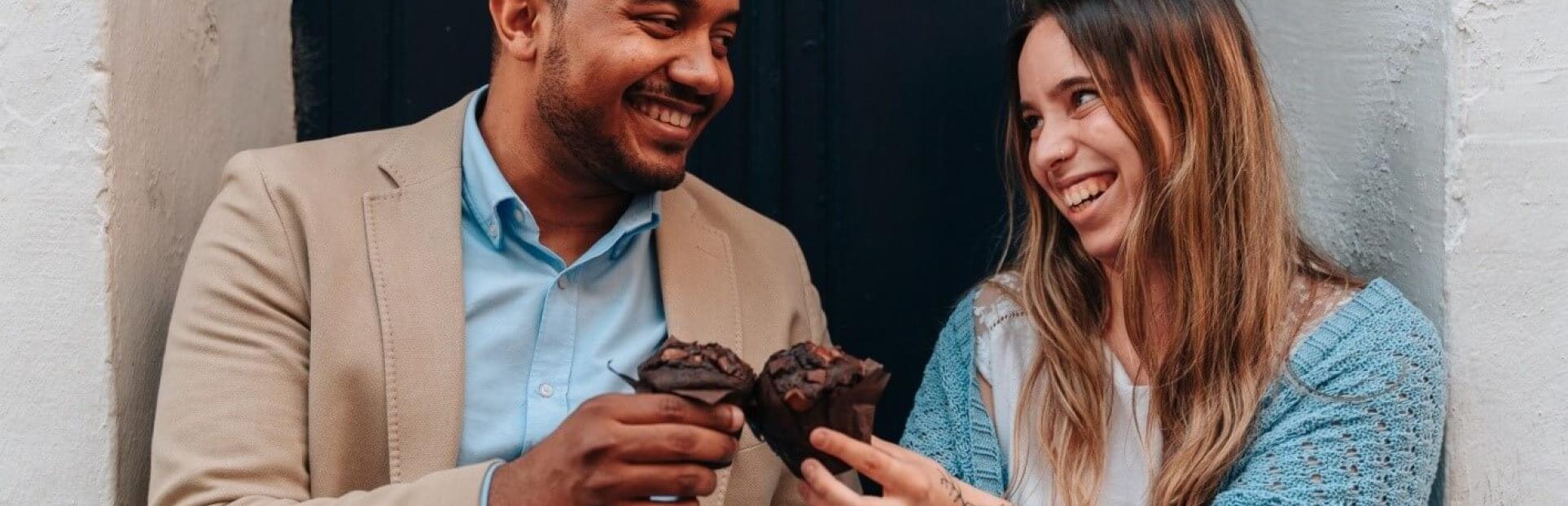couple eating muffins