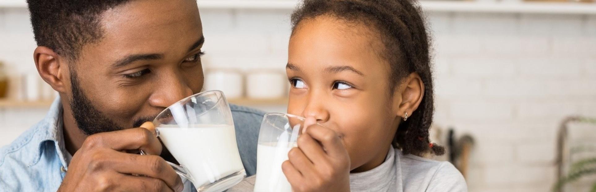 dad and daughter drinking milk