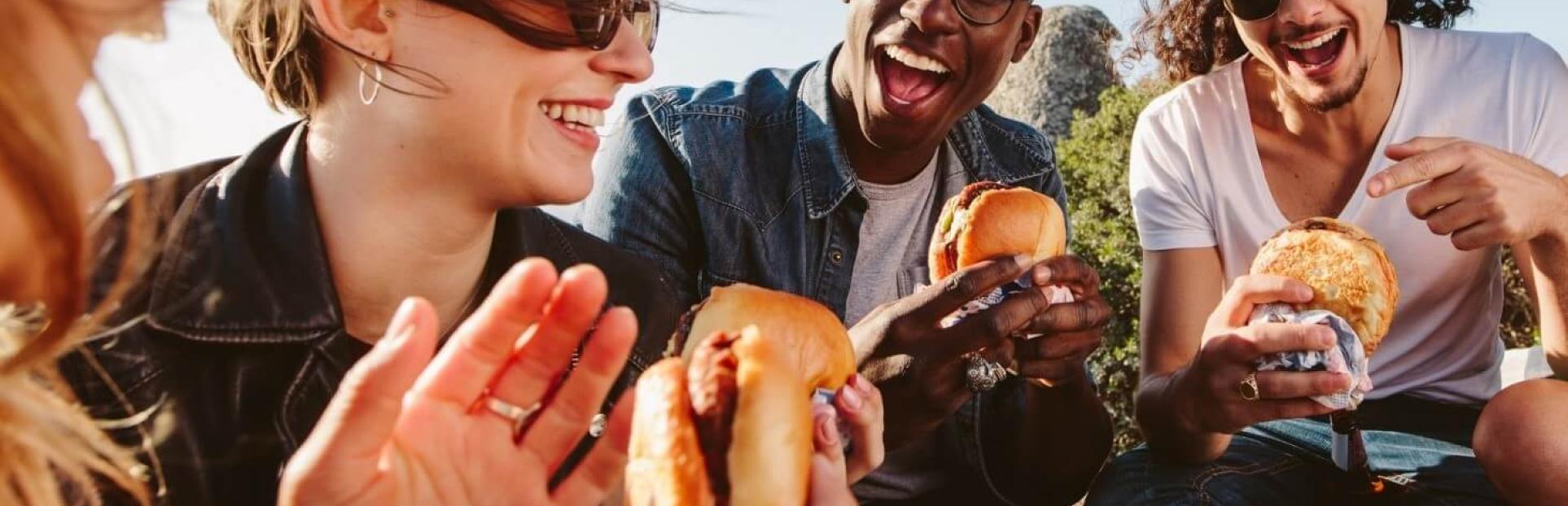 group of friends eating burger