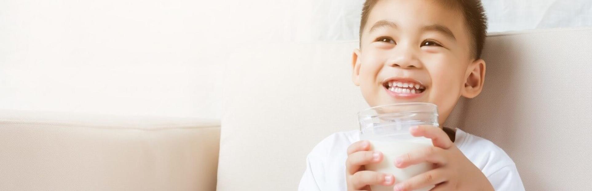 little boy with glass of milk