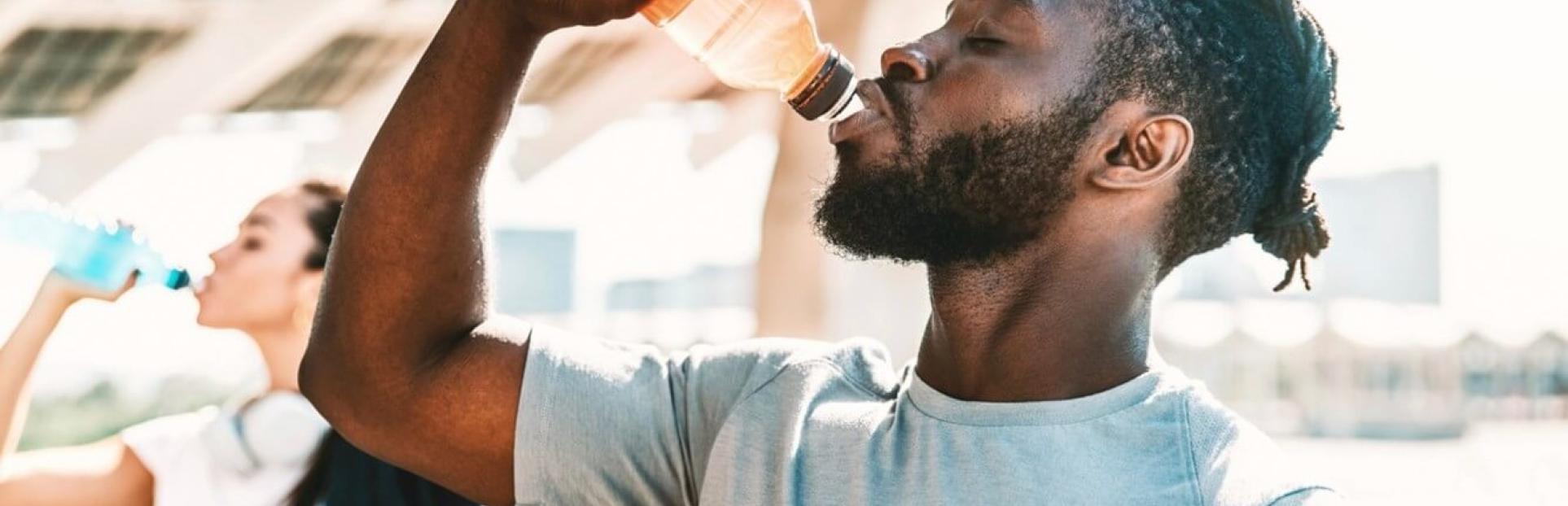 man drinking beverage