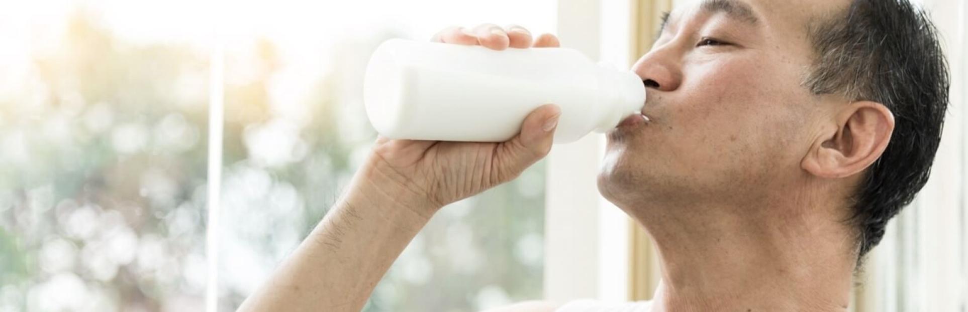 man drinking milk