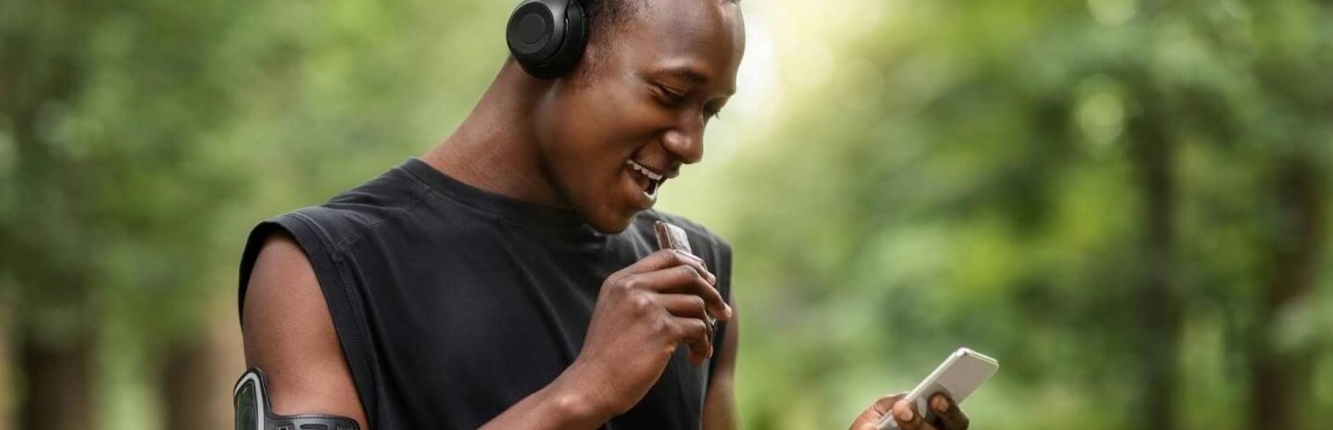 Man eating a snack bar while working out