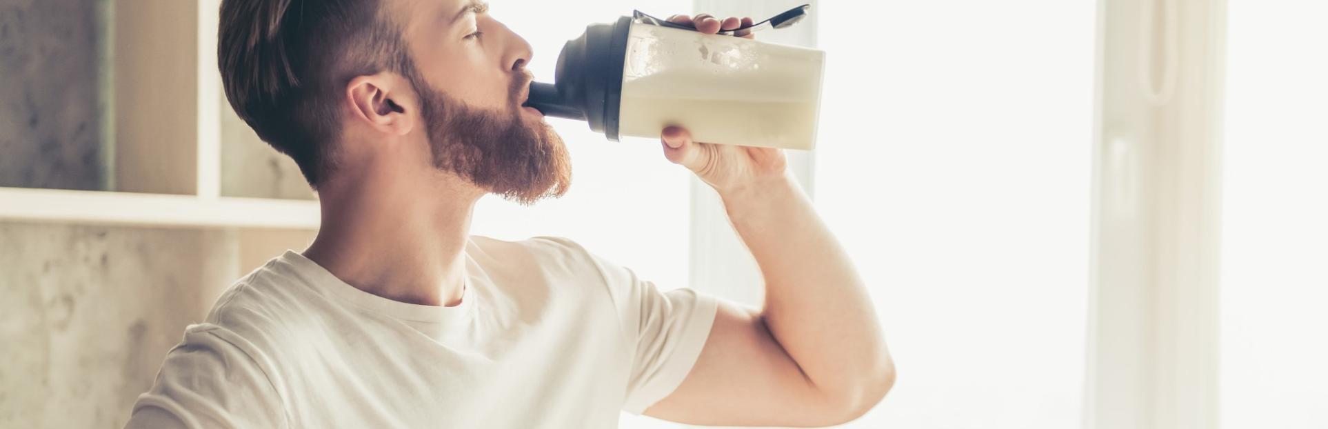 Man and Protein Powder Shaker