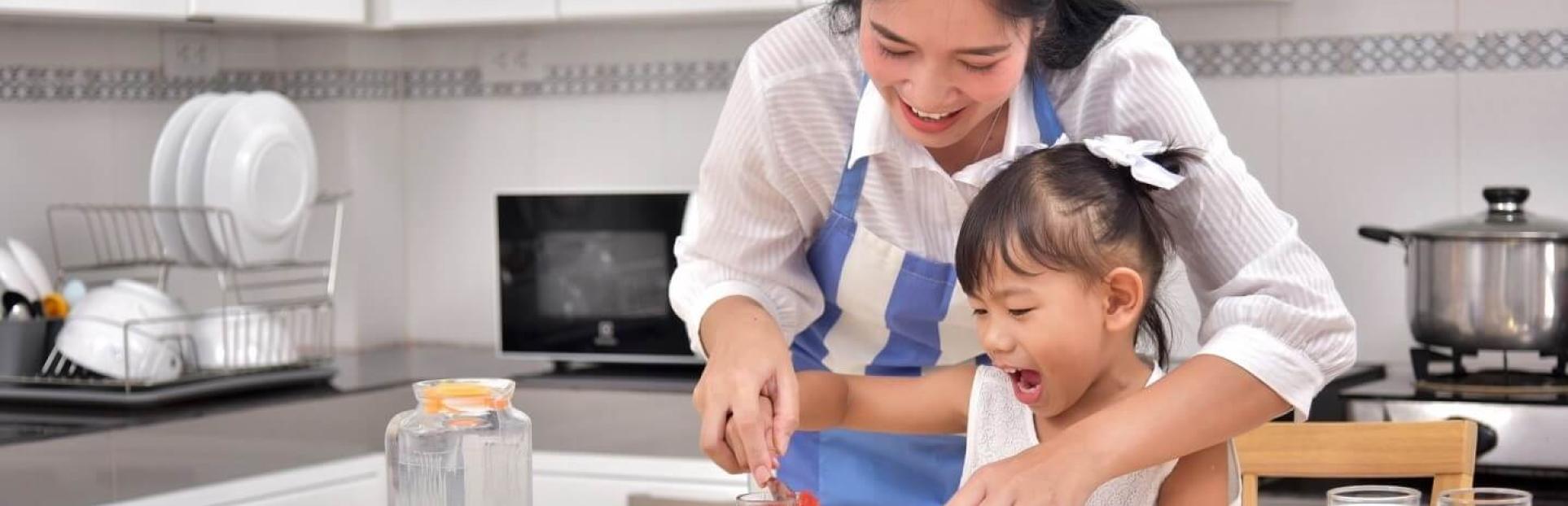 mom and daughter making toast