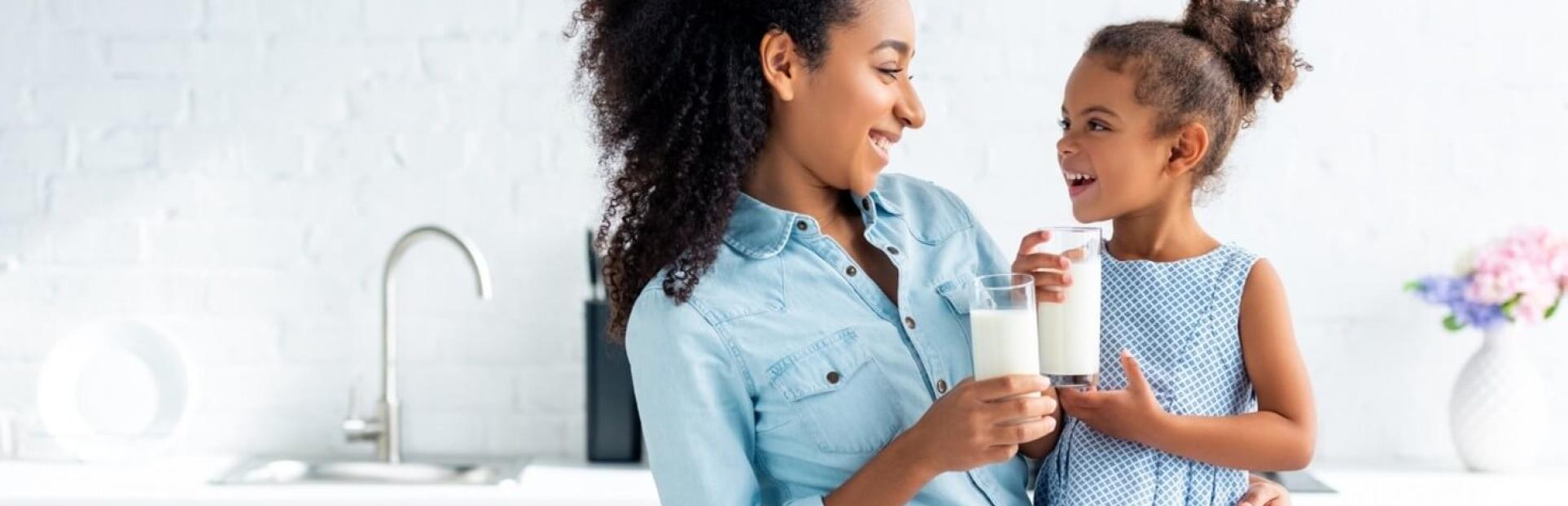 mom and daughter with milk
