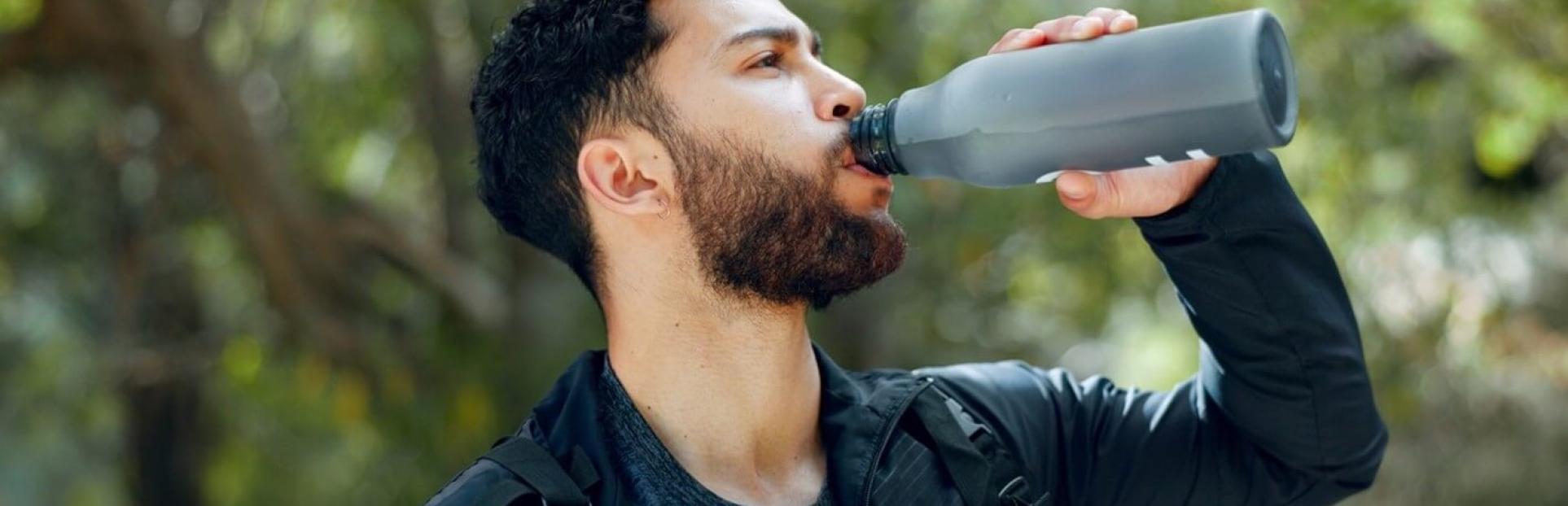 man drinking water