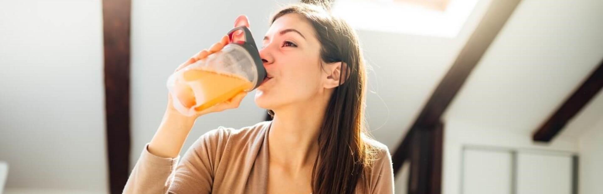 woman drinking premix drink