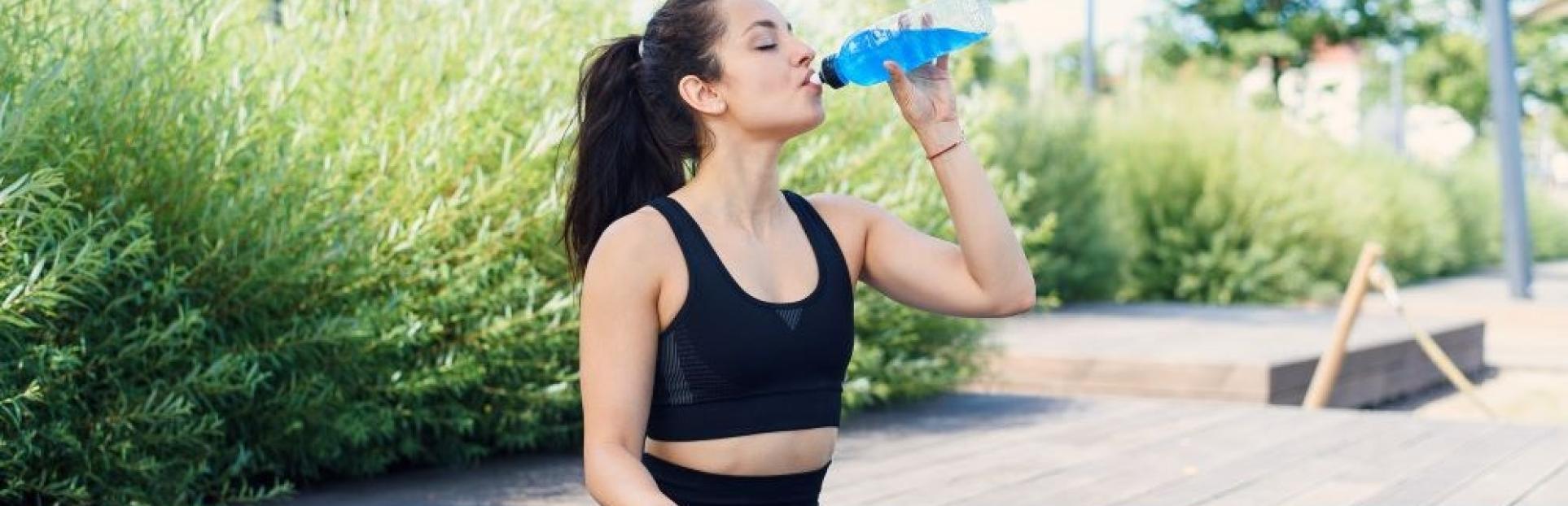 woman drinking RTD after yoga
