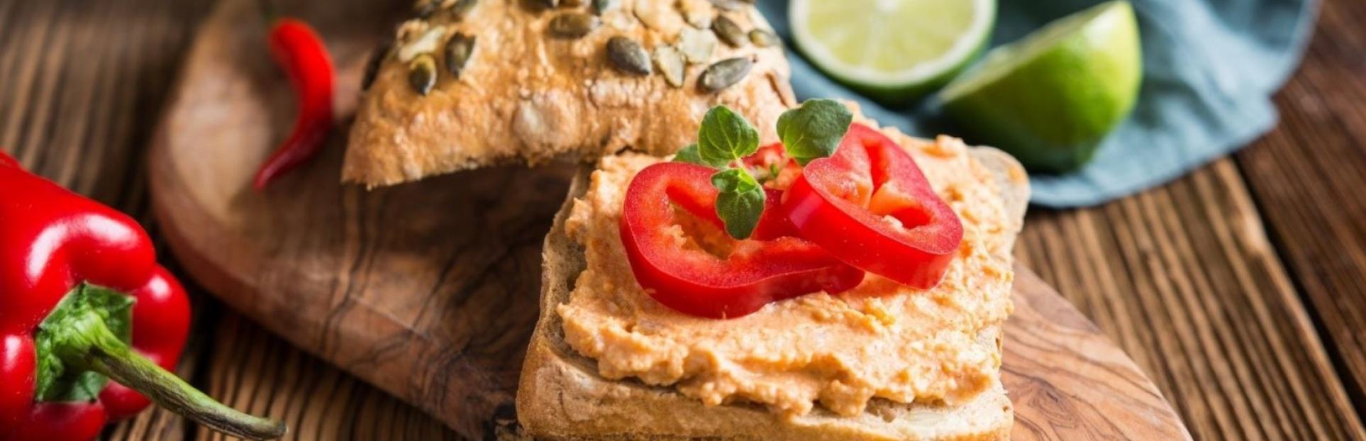 spreadable sauces on bread with wooden sandwich board