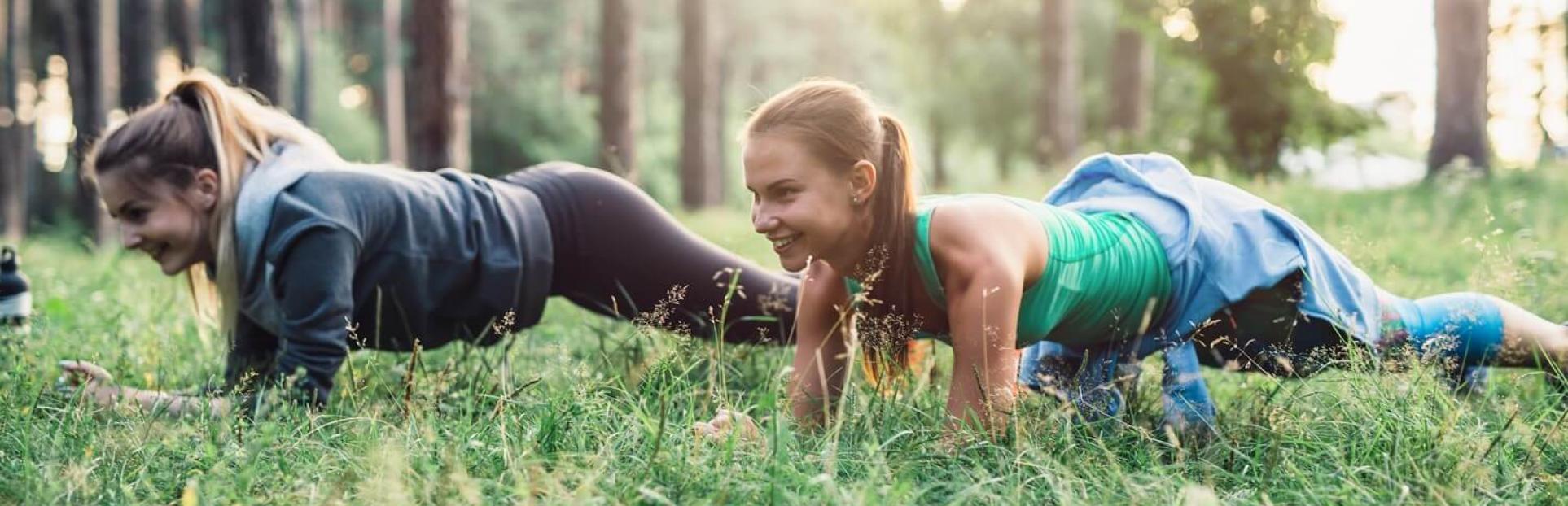 two girls doing push ups